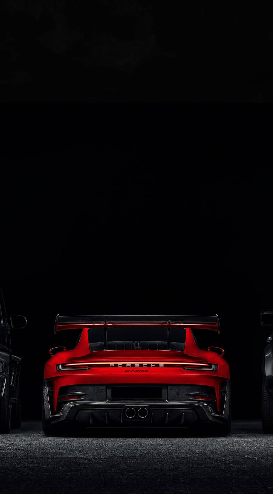 Three custom Forge vehicles, a black Mercedes G-Wagen, a red Porsche 911 GT3, and a black Land Rover Defender, are parked on a dark surface.