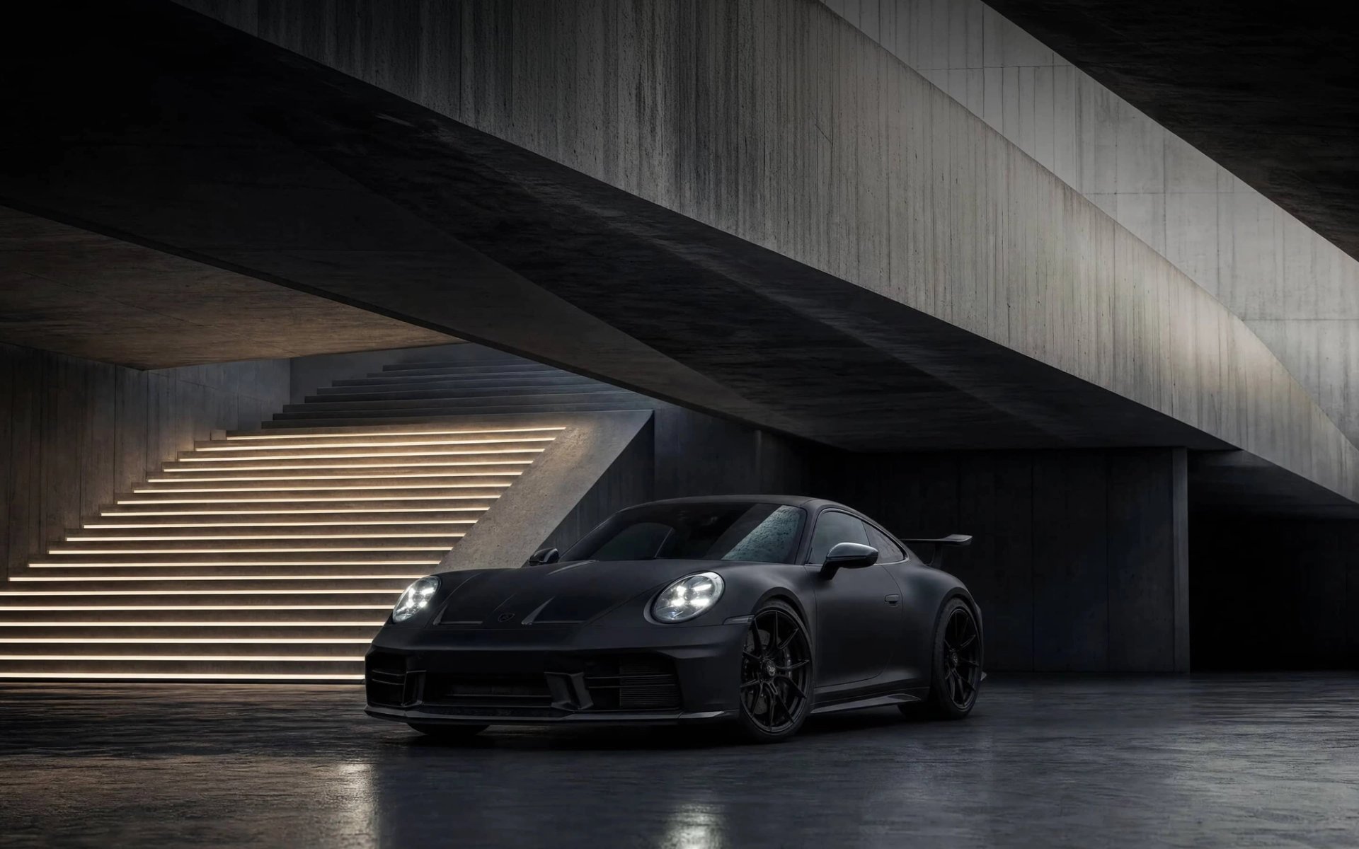 A custom Forge Porsche 911 Carrera Turbo, matte black, parked on a wet concrete floor under a brutalist structure with illuminated stairs.