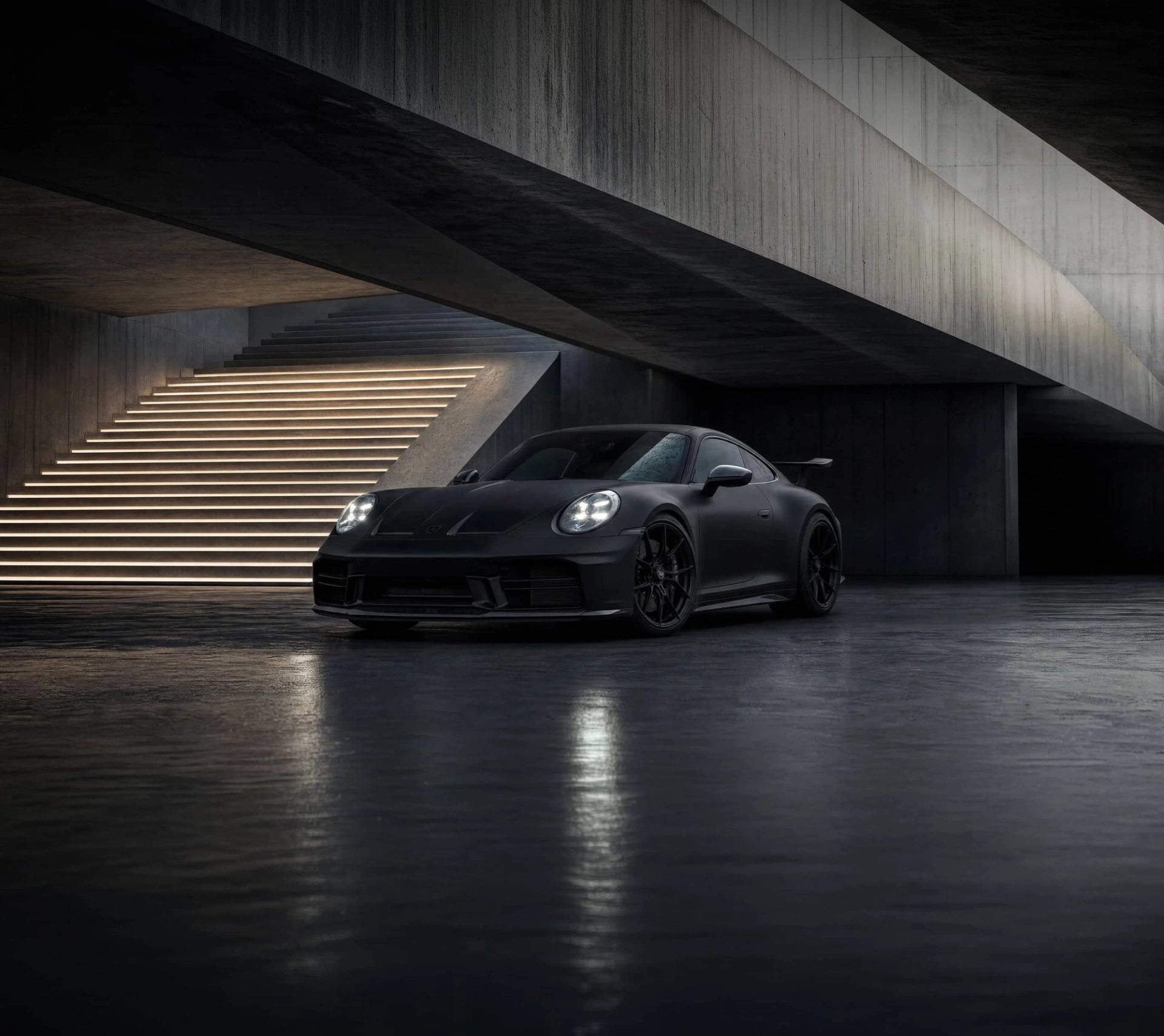 A custom Forge Porsche 911 Carrera Turbo with illuminated headlights parked on a wet concrete floor in a modern brutalist building with glowing stairs.